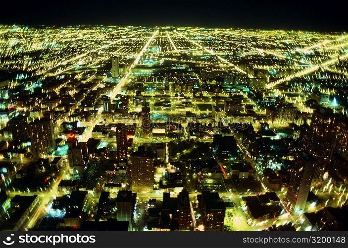 Aerial view of a city lit up at night, Chicago, Illinois, USA