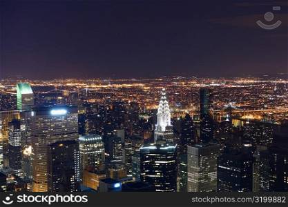 Aerial view of a city lit up at night, New York City, New York State, USA