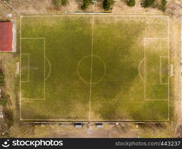 Aerial view of a football field of a district league team in a village in the heath, made with drone