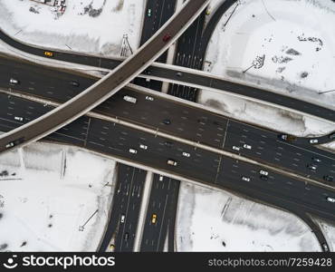 Aerial view of a freeway intersection Snow-covered in winter.