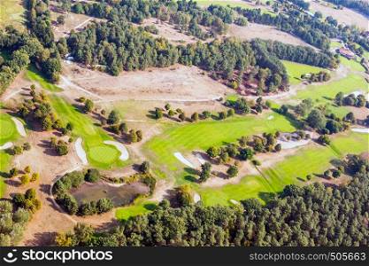 Aerial view of a golf course in the North German heath landscape.