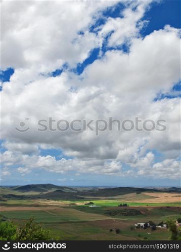 Aerial view of a green rural area under blue sky. Spain, Andalusia