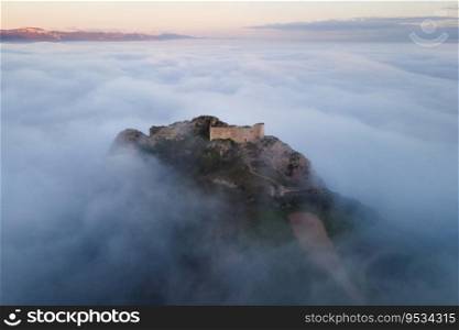 Aerial view of a medieval Cast≤in a beautiful foggy sunset, Poza de la sal, Burgos, Spain. High quality photography . . Aerial view of a medieval Cast≤in a beautiful foggy sunset, Poza de la sal, Burgos, Spain. High quality photography.