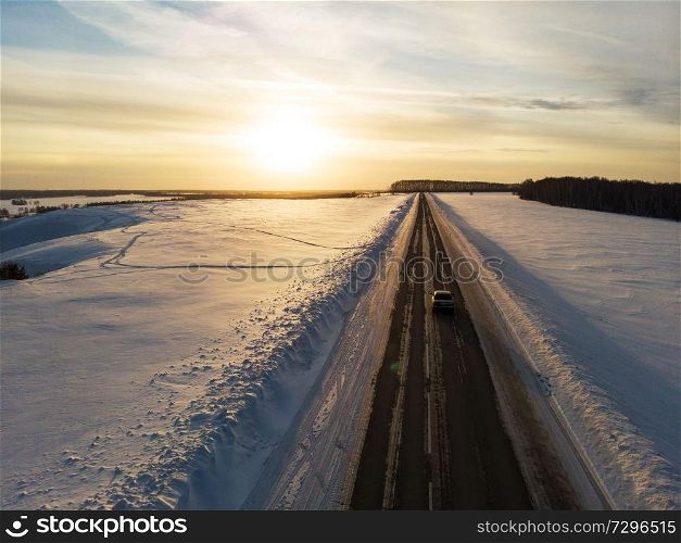 Aerial view of a road in winter landscape. Aerial view of a winter road