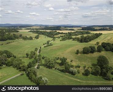 Aerial view of a scenic rural landscape area in thuringa with forest and fields