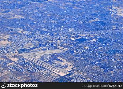 Aerial view of airport and urban sprawl.