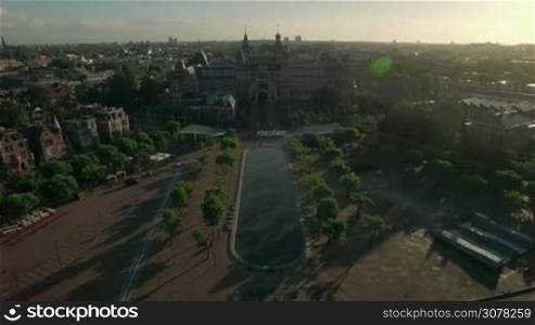 Aerial view of Amsterdam with Rijksmuseum, slogan I amsterdam and Art Square with pond at sunset, Netherlands