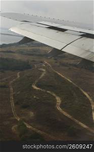 Aerial view of an airplane flying over a landscape