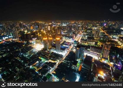 aerial view of Bangkok city downtown and road traffic at night of Thailand , Cityscape