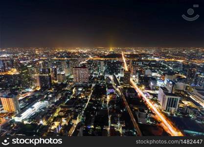 aerial view of Bangkok city downtown and road traffic at night of Thailand , Cityscape