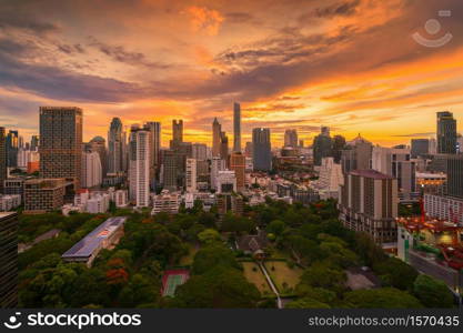 Aerial view of Bangkok Downtown skyline in Thailand. Financial district and business area in smart urban city. Skyscraper and high-rise buildings at sunset.