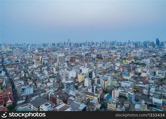 Aerial view of Bangkok Downtown skyline, Thailand. Financial business district and residential area in smart urban city. Skyscraper and high-rise buildings at sunset.