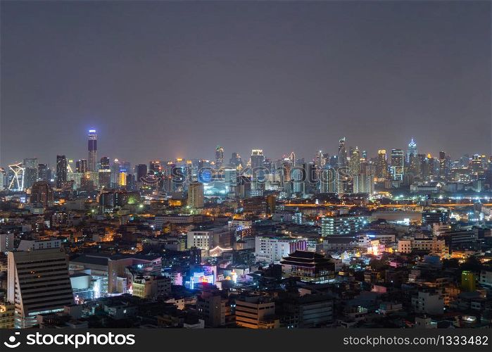 Aerial view of Bangkok Downtown skyline, Thailand. Financial business district and residential area in smart urban city. Skyscraper and high-rise buildings at night time.
