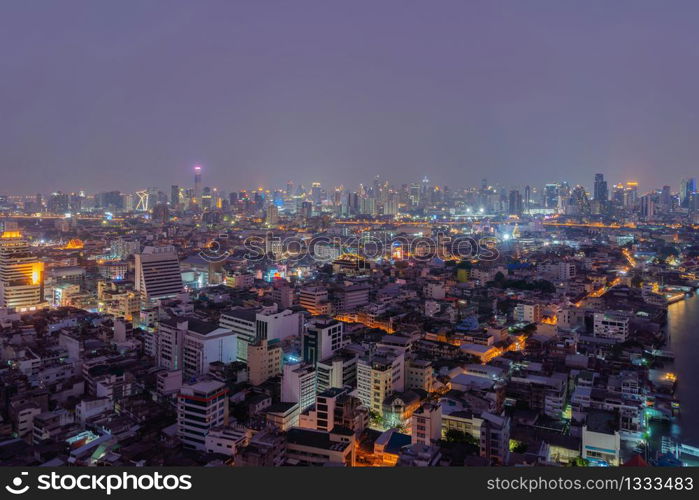 Aerial view of Bangkok Downtown skyline, Thailand. Financial business district and residential area in smart urban city. Skyscraper and high-rise buildings at night time.