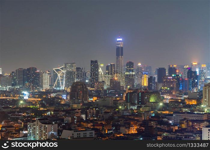 Aerial view of Bangkok Downtown skyline, Thailand. Financial business district and residential area in smart urban city. Skyscraper and high-rise buildings at night time.