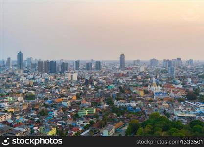 Aerial view of Bangkok Downtown skyline, Thailand. Financial business district and residential area in smart urban city. Skyscraper and high-rise buildings at sunset time.