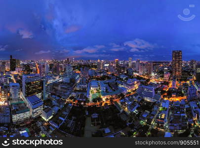 Aerial view of Bangkok Downtown Skyline. Thailand. Financial district and business centers in smart urban city. Skyscraper and high-rise office buildings at night.