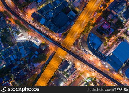 Aerial view of Bangkok Downtown Skyline with road street highways. Thailand. Financial district and business centers in smart urban city in Asia. Skyscraper and high-rise buildings at night.