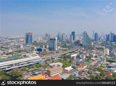 Aerial view of Bangkok Downtown Skyline with road street. Thailand. Financial district and business centers in smart urban city in Asia. Skyscraper and high-rise buildings.