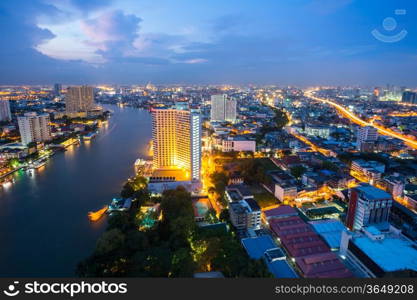 Aerial view of Bangkok Skyline along Chaophraya River at dusk