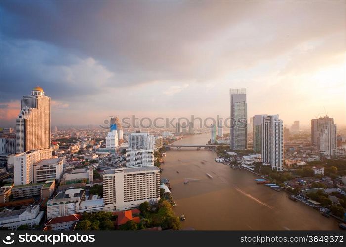 Aerial view of Bangkok Skyline along Chaophraya River sunset