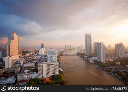 Aerial view of Bangkok Skyline along Chaophraya River sunset
