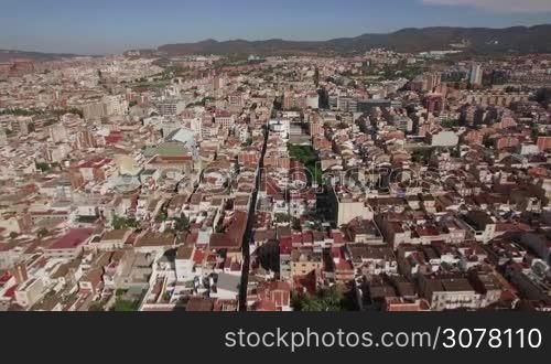 Aerial view of Barcelona with lots of houses. It is one of the most densely populated cities in Europe