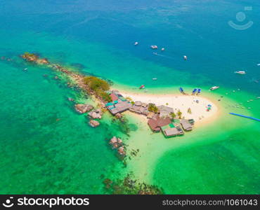 Aerial view of beach at Koh Khai, a small island, with crowd of people, tourists, blue turquoise seawater with Andaman sea in Phuket island in summer, Thailand in travel trip. Nature landscape.