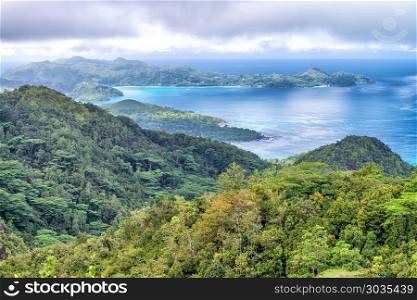 Aerial view of beautiful island mountains. Vegetation and ocean.. Aerial view of beautiful island mountains. Vegetation and ocean