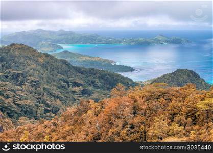 Aerial view of beautiful island mountains. Vegetation and ocean. Autumn colors.. Aerial view of beautiful island mountains. Vegetation and ocean.
