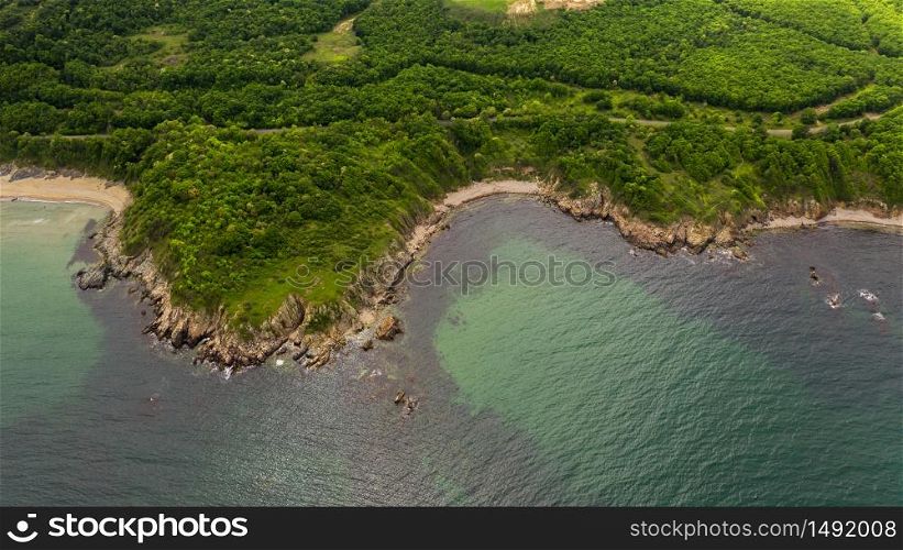 Aerial view of beautiful rocky beach and forest