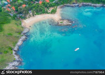 Aerial view of beautiful tropical beach and sea with palm and other tree in Phuket island for travel and vacation. Yanui Beach