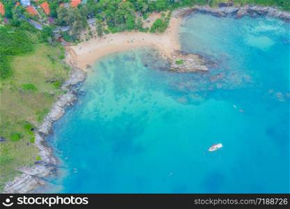 Aerial view of beautiful tropical beach and sea with palm and other tree in Phuket island for travel and vacation. Yanui Beach