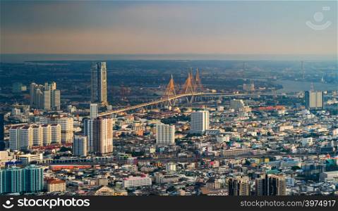 Aerial view of Bhumibol Bridge and Chao Phraya River in structure of suspension architecture concept, Urban city, Bangkok. Downtown area at sunset, Thailand.