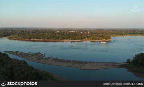 Aerial view of big siberian Ob river and boats in beauty summer day, 4K drone footage.. Aerial view of river and boats