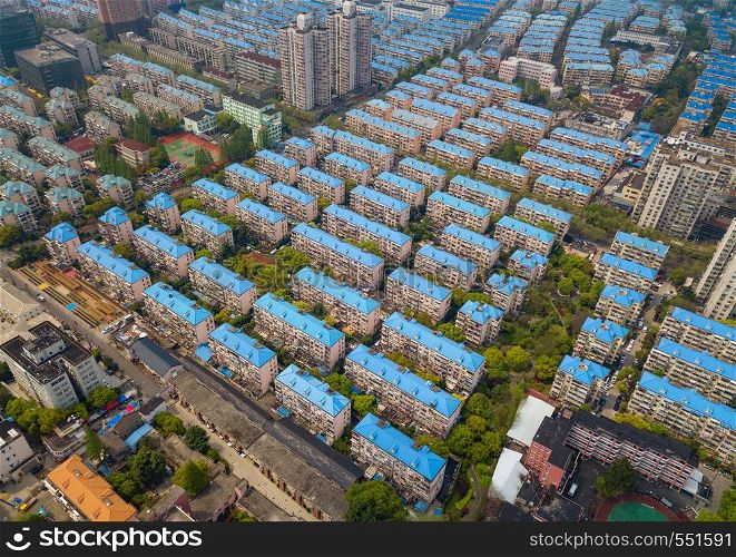 Aerial view of blue houses. Residential neighborhood. Urban housing development from above. Top view. Real estate in Shanghai City, China