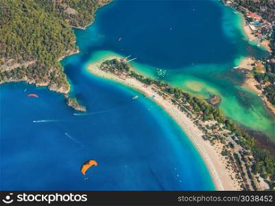 Aerial view of Blue Lagoon in Oludeniz, Turkey. Colorful summer landscape with sea spit, green forest, azure water, sandy beach in bright sunny day. Travel background. Top view of national park.Nature. Colorful summer landscape with sea spit, green forest, azure wat