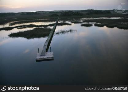 Aerial view of boat dock and walkway over marsh at Bald Head Island, North Carolina.
