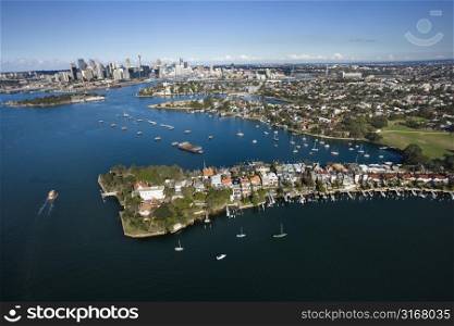 Aerial view of boats in Snails Bay with view of downtown skyline in Sydney, Australia.