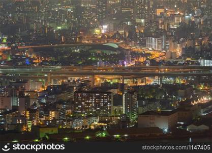Aerial view of bridges and roads in Osaka downtown. Skyline with skyscraper buildings in Kansai district, urban city, Japan. Architecture landscape background.