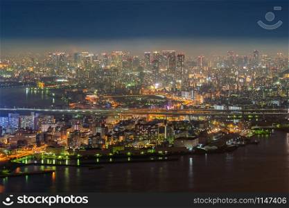 Aerial view of bridges and roads in Osaka downtown. Skyline with skyscraper buildings in Kansai district, urban city, Japan. Architecture landscape background.