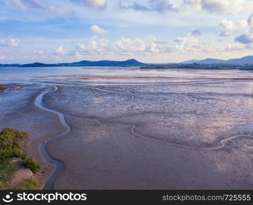 Aerial view of brown wave sand dune or rock pattern texture background on sea beach in Phuket island, Thailand