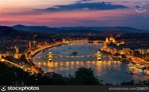Aerial view of Budapest and illuminated landmarks at sunset