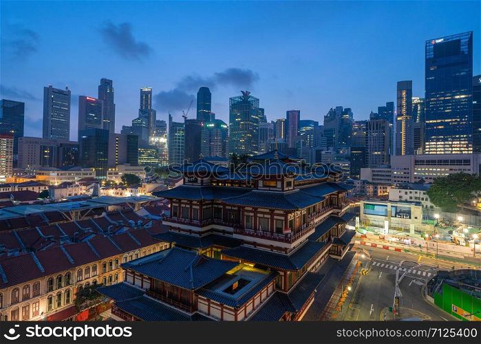 Aerial view of Buddha Tooth Relic Temple in China town, Singapore Downtown skyline. Financial district and business centers in technology smart urban city in Asia. Skyscraper and high-rise buildings.