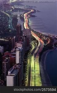 Aerial view of buildings along a highway in a city, Lake Michigan, Chicago, USA