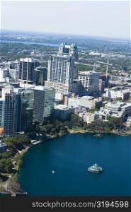 Aerial view of buildings along a lake, Lake Eola, Lake Eola Park, Orlando, Florida, USA