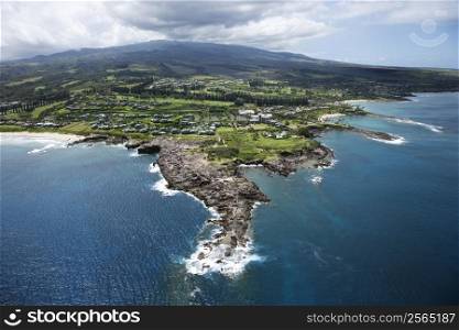Aerial view of buildings on coastline of Maui, Hawaii.