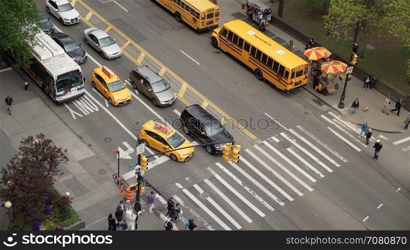 Aerial view of cars and pedestrians at an intersection