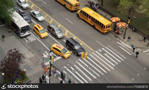 Aerial view of cars and pedestrians at an intersection