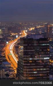 Aerial view of cars driving on highway junctions. Bridge street roads in connection network of architecture concept. Top view. Urban city, Bangkok at night, Thailand.